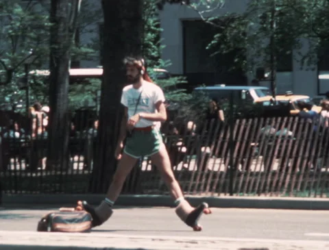 1980S YOUNG MAN ROLLER SKATING IN SPRING IN NEW YORK CITY (1982) Stock Footage 288386361