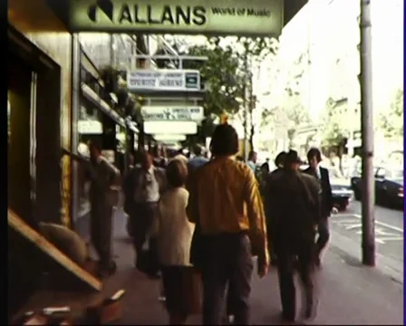 (1981) CAMERA WALKS DOWN MELBOURNE CITY SHOPPING DISTRICT Video stock 37602974
