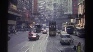 1982: Traffic Moves Quickly Through A Busy City Street In Asia Hong Kong Stock Footage