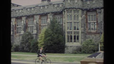 1982:NEW ZEALAND. Crosses And A Person Bicycling Next To A Stone Building Named Stock Photos