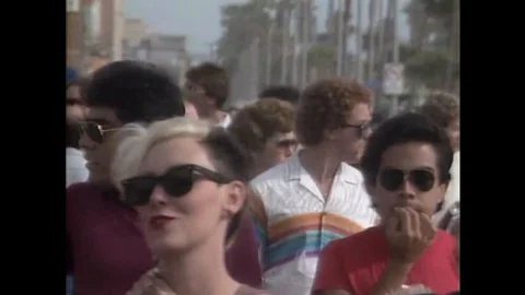 1984 - Street performers are shown in Venice Beach in California. Stock Footage