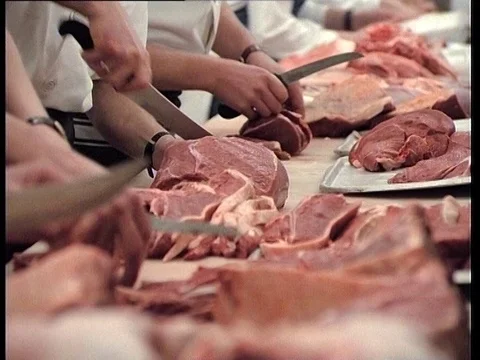1985: Raw Meat Being Sliced By Hand  Stock Footage 84840591