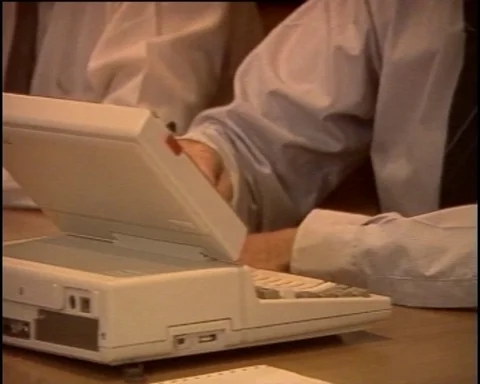 1987: First Laptop Computers at Business Meeting Stock Footage 112537324