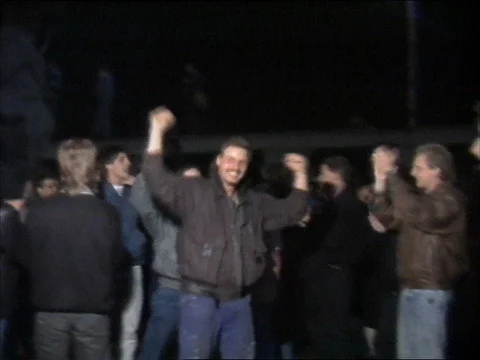 1989 FALL OF BERLIN WALL: chanting and clapping citizens Stock Footage 77871671