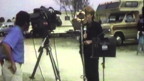 1990 Archival VHS Local Televison News Reporter Crowd Watching Video stock 78765433