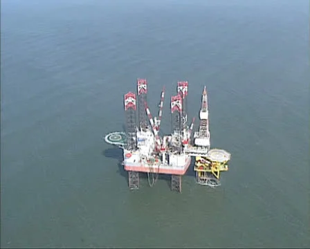 1990s Aerial view drilling platform Neddrill 4 North Sea - medium shot Stock Footage 25519376