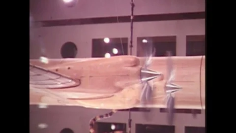 1990s: airplane testing in laboratory. Wobbling motion on plane. Propeller whirl Stock Footage