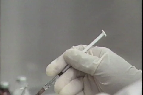 1990s Archival Lab  - Closeup Hands with Syringe Stock Footage 106044577
