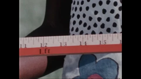 1990s: Close up pan of hands with ruler. Hands set down ruler, pan across rulers Stock Footage 266844843
