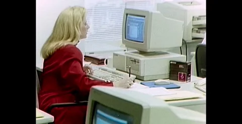 1990s DESKTOP OFFICE COMPUTERS ARRIVE Stock Footage 258321337