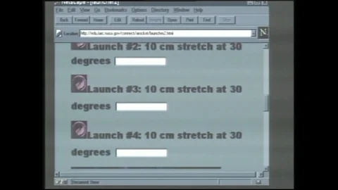 1990s: Mouse icon on computer screen scrolls down list of options. Two women sit Stock Footage 120487864