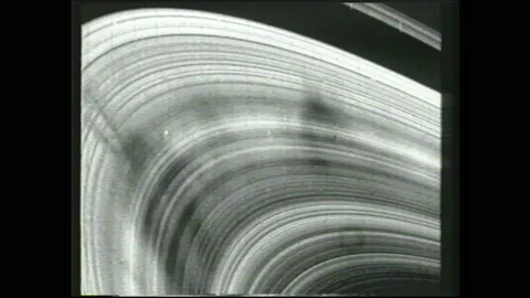 1990s: Rings of saturn. Probe floating through space. Titan moon floating in Stock Footage 159100012