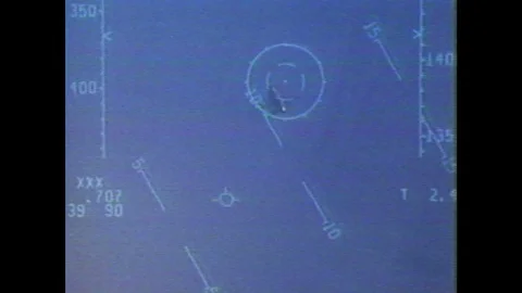 1990s: Scope view of aircraft flying. Timecode superimposed over flying Stock Footage 104267802