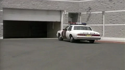 1990s SHERIFF PATROL COP CAR RETURNING BACK TO HQ Stock Footage 273447253