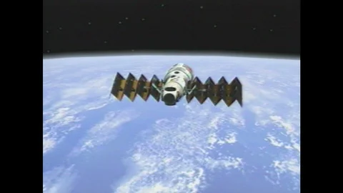 1990s: Space station expands solar array. Space station component docks with 스톡 동영상 104268233
