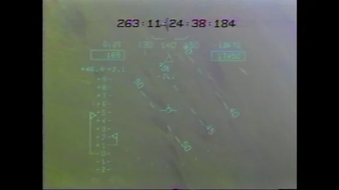 1990s: Timecode superimposed over flying aircraft followed by simulation. Stock Footage 104267811