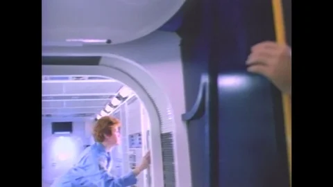 1990s: Two scientists aboard international space station in residential Stock Footage