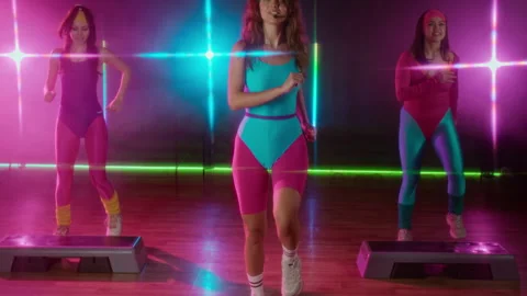 1990s Women Exercising with Instructor at Step Aerobics Class Stock Footage 328366796