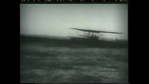 1990s: Wright Brothers plane taking flight in field. Chuck Yeager's orange, test Stock Footage 113988714