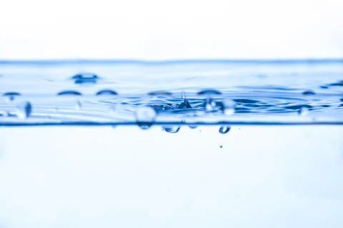 199.Ripples and Bubbles in Blue Gradient Water Surface Stock Photos
