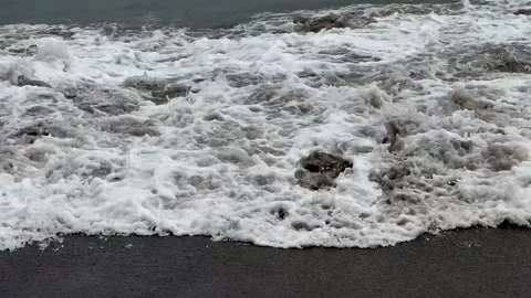 19Low angle of the seashore with weak waves near the shore Stock Footage 210536820