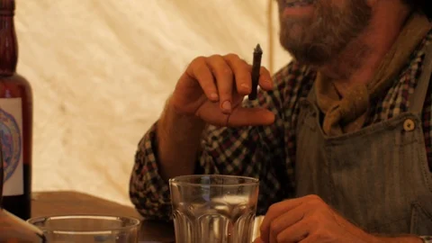 19th Century Working-Class Men Drinking and Gambling in a Grimy Tent Stock Footage 99749421