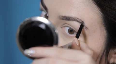 1Girl painted eyebrows Stock Footage 62407564