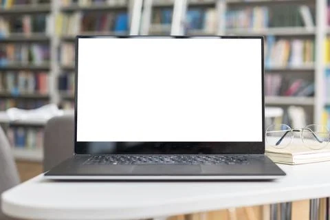 1laptop with empty screen library. High quality photo Stock Photos