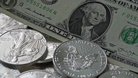1oz Silver Dollar Eagle Coins with One Dollar Banknode Currency Finance Stock Footage 224290682