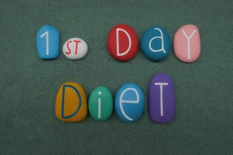 1st Day Diet, creative communication composed with multicolored stone letters Stock Photos