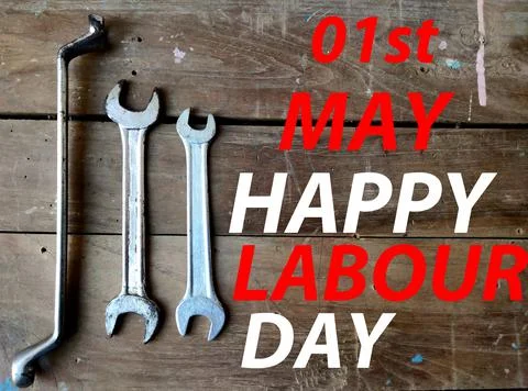 1st May is Happy Labour Day Poster of wooden texture with mechanical tools. Stock Photos