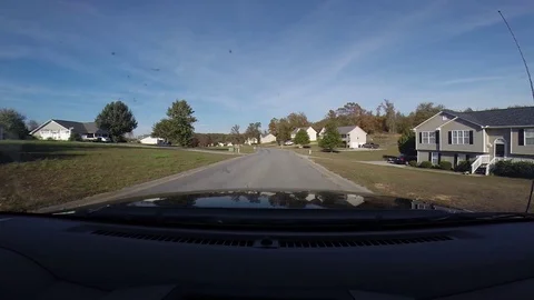 1st-Person driving thru neighborhood Stock Footage