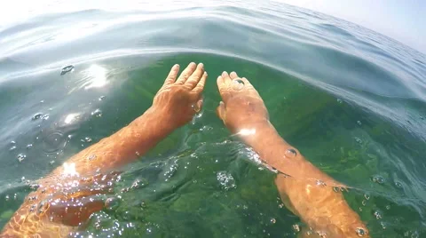 1st person POV of swimmer in sea water swimming frog style Stock Footage