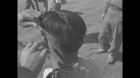 1st ROK Division soldier gets haircut outside of tent - 1951 Stock Footage 92483447