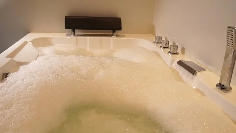 1Water flows in jacuzzi. Spa bathroom with hydromassage and foam. Stock-Footage 109501817