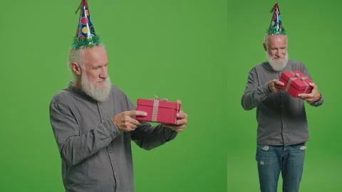 2-in-1 Split Green Screen Montage.An Old Man in a Birthday Hat with a Red Gift Stock Footage 242203418