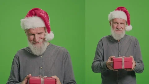 2-in-1 Split Green Screen Montage.An Old Man in a Santa Hat with a Red Gift Box. Stock Footage 242809832