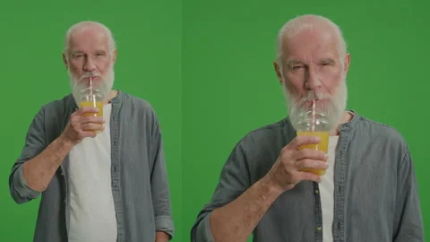 2-in-1 Split Green Screen Montage.An Old Man Drinks Orange Cocktail with Juice. Video stock 243137775