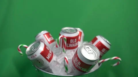 2-2 green screen rotating beer cans in an ice bucket with hanging candy Stock-Footage 145212174