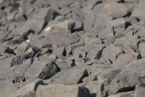 2 - Abstract full frame sharp stone boulder background texture, golden hour Stock Photos