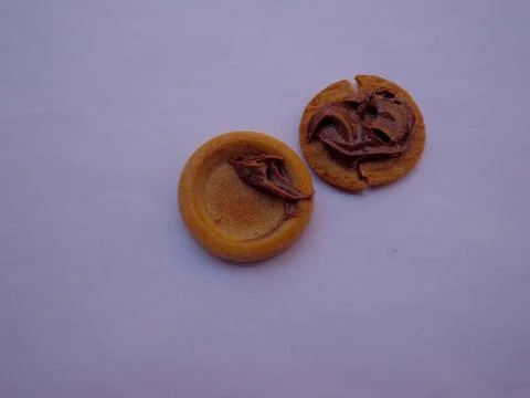 2 biscuits with chocolate spread on top 스톡 사진