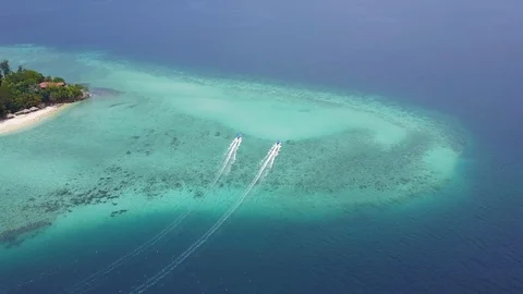 2 boat side by side in the ocean depart from Manukan Island Stock Footage 104535297