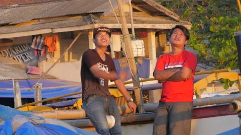 2 Boys looking at kite on beach at sunset,Pangandaran,Java,Indonesia Stock Footage 55644642