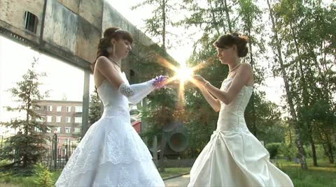 2 brides are helding a sun (static) Stock Footage 11226209