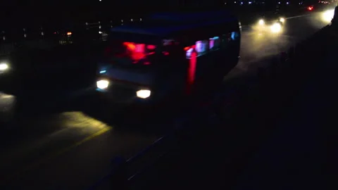 2 buses in a Huge traffic full of vehicles in a highway road at night Stock Footage 248733513