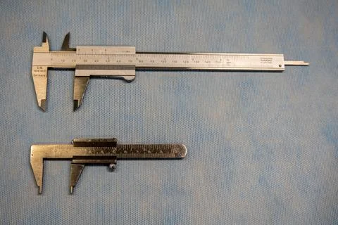 2 calipers of different sizes lie next to each other Stock Photos