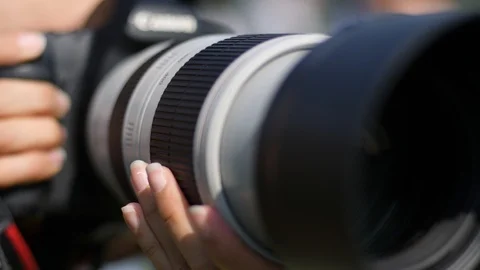 2 Camera long focus lens professional photographer woman shooting public even Stock Footage 94623445