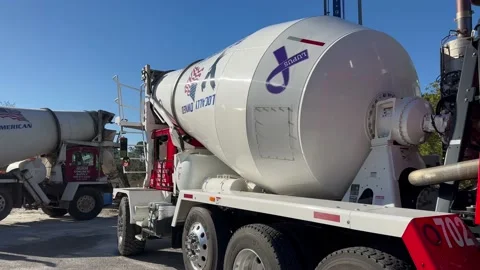2 cement trucks ready to offload cement on job site Видео 233039359