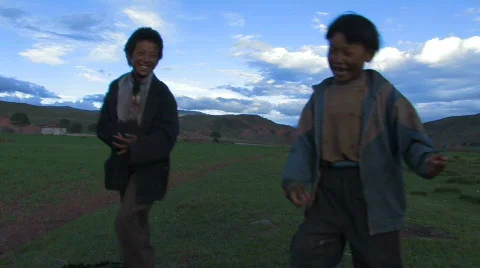 2 Children dancing and singing in Tibet. Stock Footage 296199