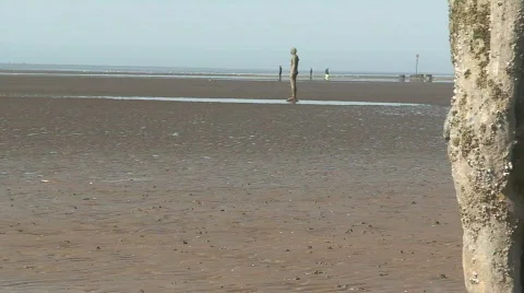 2 clips of Anthony Gormley's Another Place Stock Footage 66121